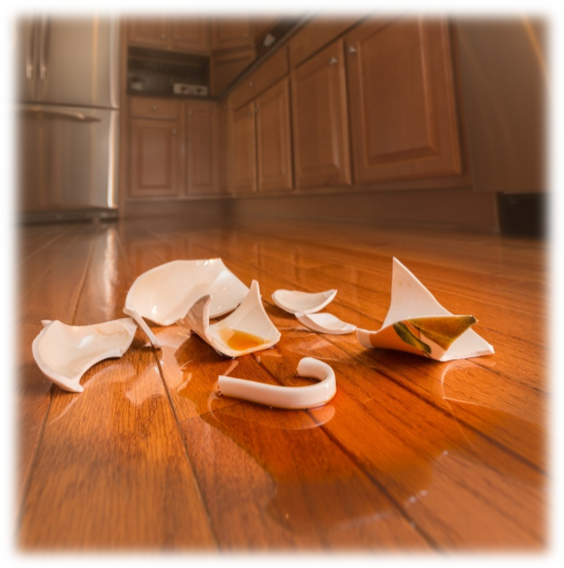 broken mug with tea on waterproof-flooring