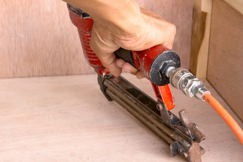 using air compressed nail gun to install hardwood floor