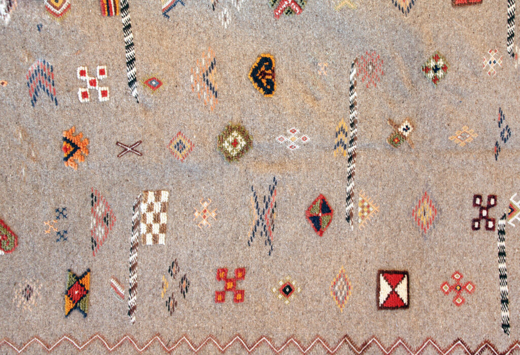 Texture of traditional handmade wool carpet with geometric pattern, Morocco, Africa